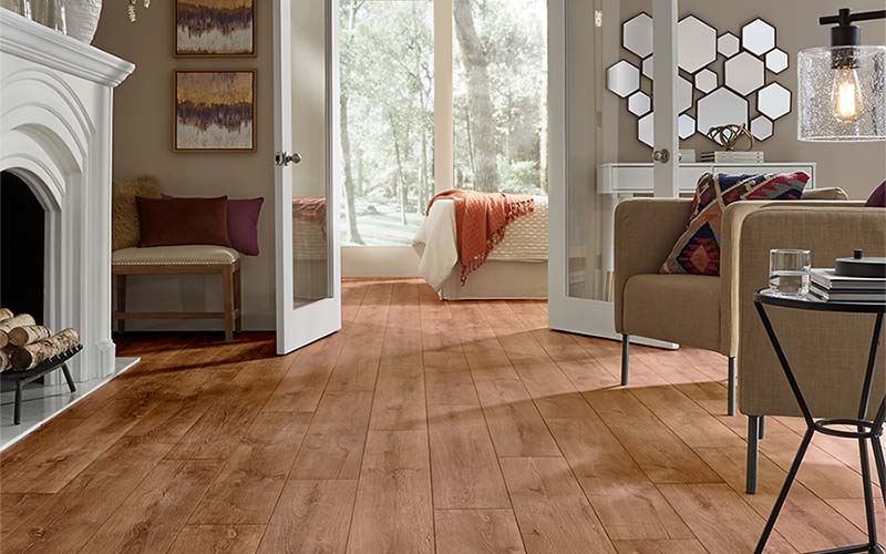 Reddish wood-look luxury vinyl plank modern room scene